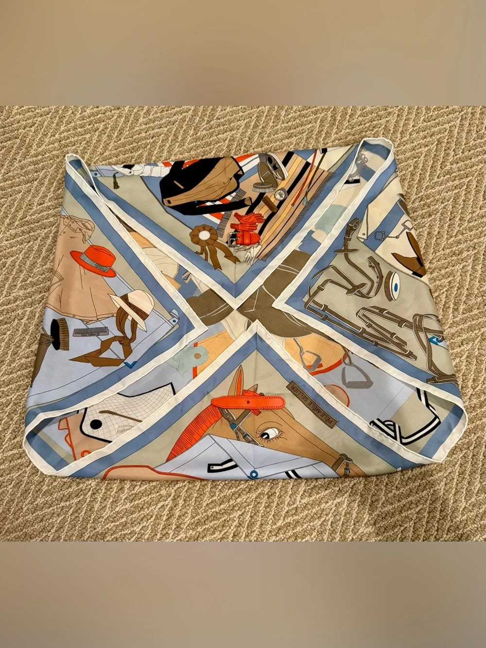 Hermes Pele Mele Silk Scarf with leather buckle.